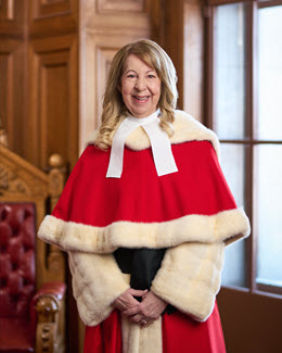 Mary T. Moreau in red ceremonial robe