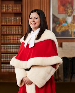 Michelle O'Bonsawin in red ceremonial robe