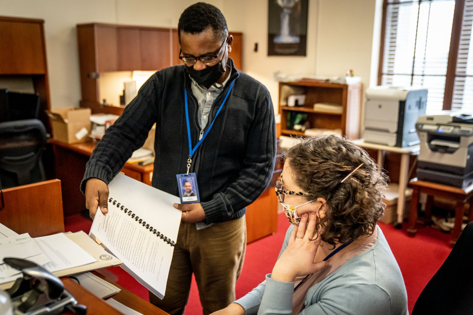 Employees looking at a document 