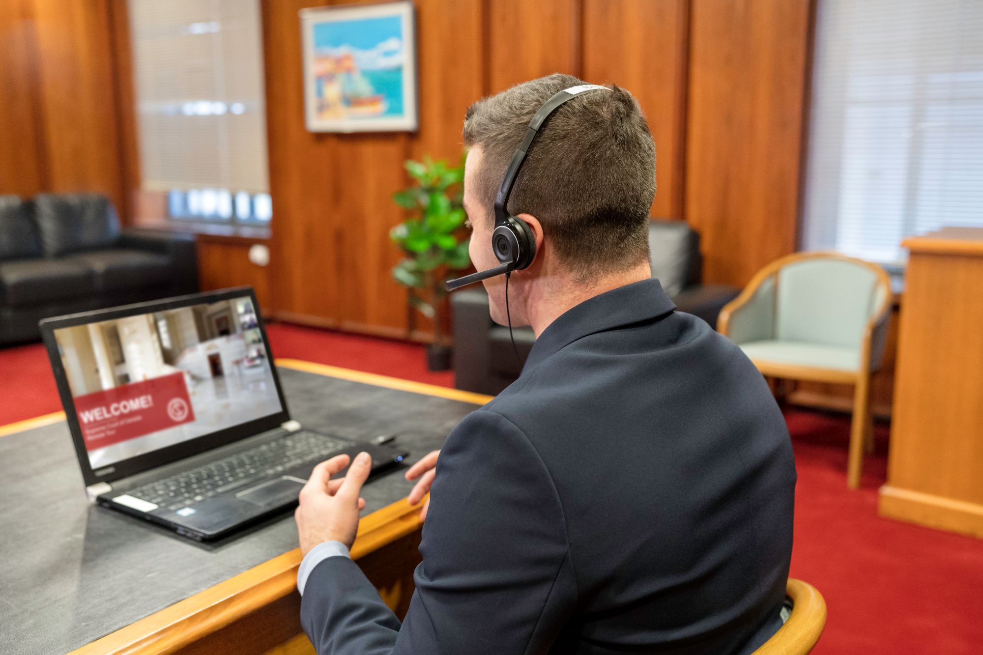 A tour interpreter at his computer