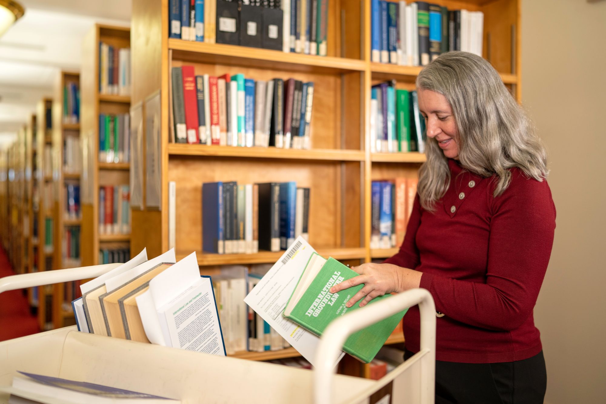 An employee handling books